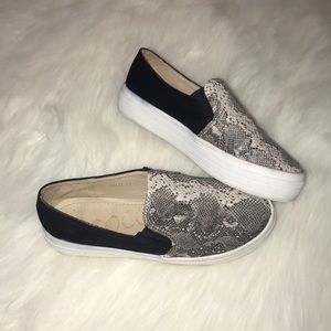 black and snakeskin platform slip ons